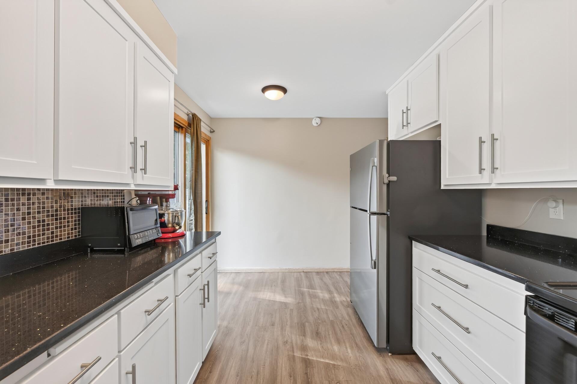 Kitchen Facing Sliding Glass Door to Deck
