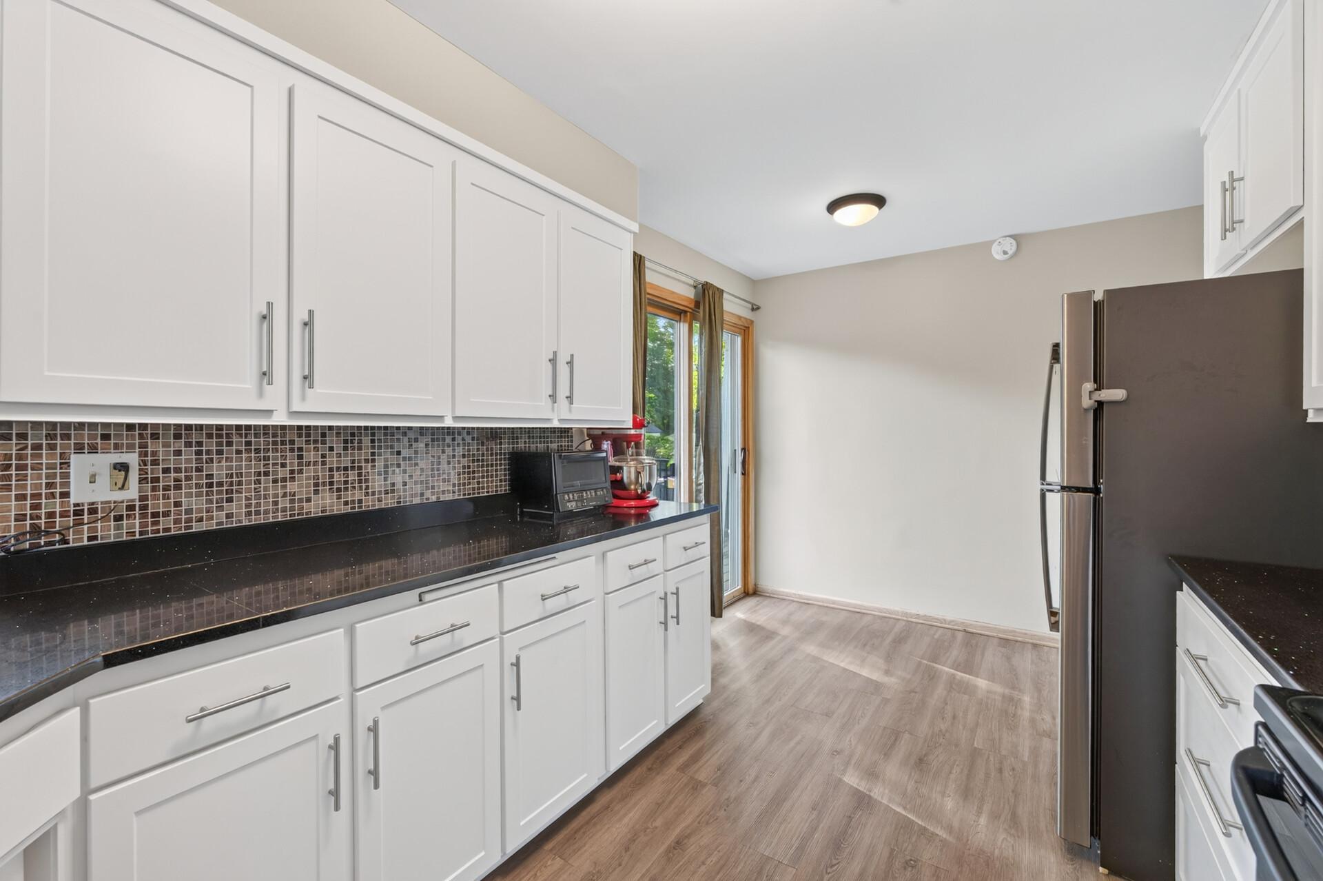 Kitchen Facing Sliding Glass Door to Deck