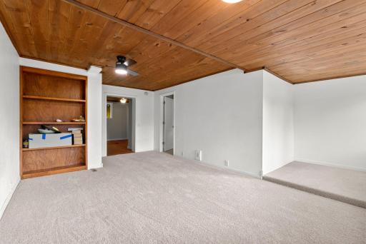 Unit 1 has impressive wood ceilings and open kitchen.