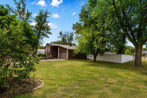 Fantastic curb appeal on a huge corner lot with mature trees, tons of yard space & room to enjoy!