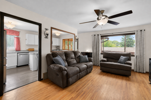 Bright & inviting living room featuring gorgeous hardwood floors, abundant natural light and an open flow to the kitchen!