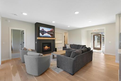 Inviting family room anchored by a beautiful gas fireplace, creating a warm and welcoming gathering space.