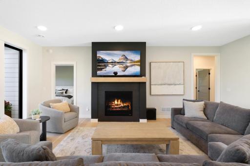 Spacious family room comfortably accommodates two sofas and additional seating, creating a wonderful gathering space.