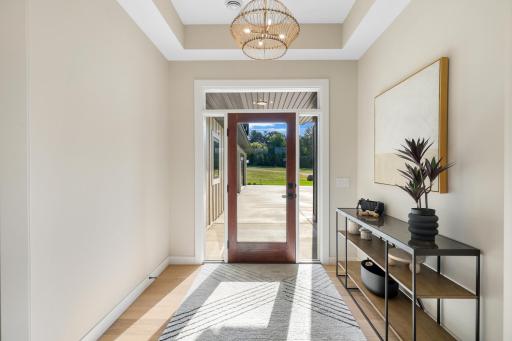 Welcoming entry featuring sidelights and transom window for abundant natural light.