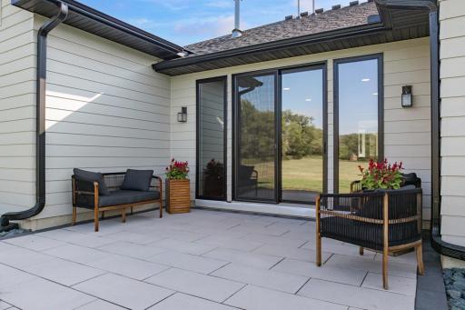 Expansive backyard patio offers plenty of space to relax, entertain, and take in beautiful sunset views. Perfect spot out back for a future inground pool.