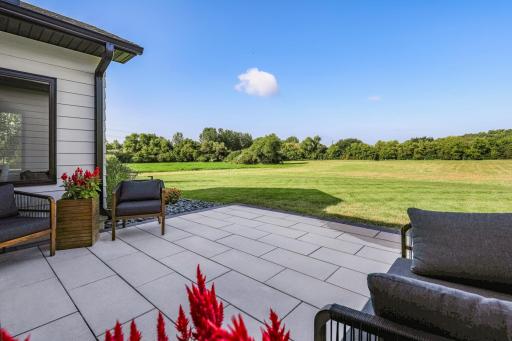 Thoughtfully designed landscape rock directs water away from the home for added protection when watering.