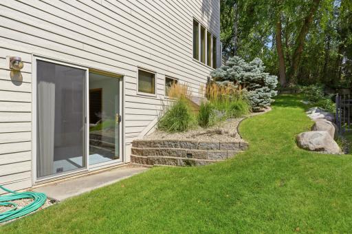 Walkout from the lower level to the side yard of the home