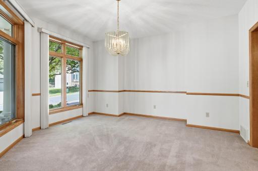 Another view of the formal dining room with chair rail. Formal dining could also be used as a main floor office or den