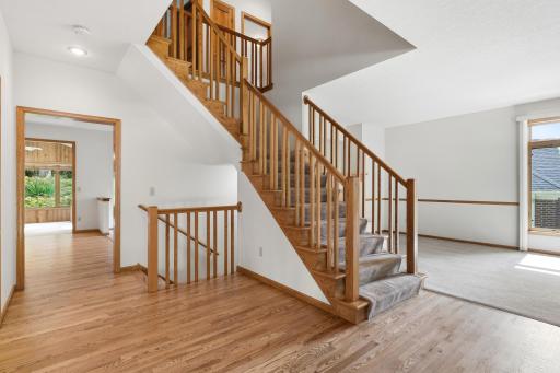 Step inside and you enter a large 2 story entry foyer with beautiful hardwood floors