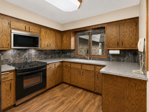 Kitchen is virtually painted to show a neutral paint color. Actual color is a blue.