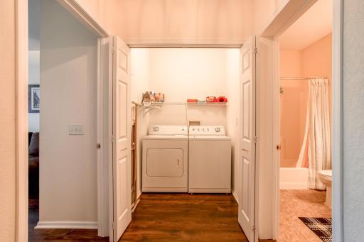 Convenient in-unit laundry area with full-size washer and dryer is located just steps from the second bedroom and bathroom.