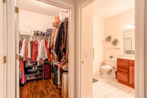 Generous walk-in closet provides abundant hanging and storage space with convenient access next to the private primary bath.