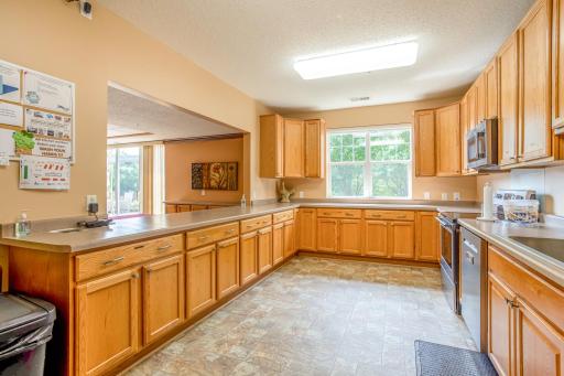 Another view showcases the kitchenâs impressive amount of workspace and storage, making hosting larger gatherings a breeze.