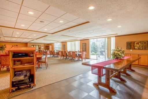 A spacious community party room provides abundant seating and flexible space for celebrations, gatherings, and special events.