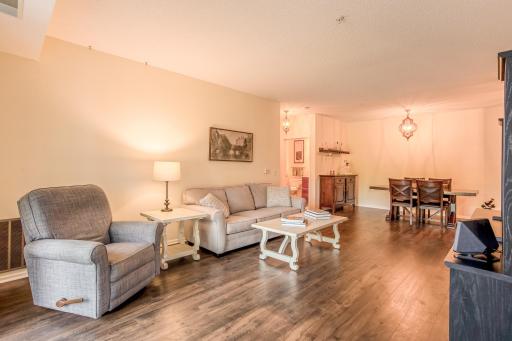 Spacious open-concept living and dining area with LVP flooring and plenty of room for relaxing or entertaining.