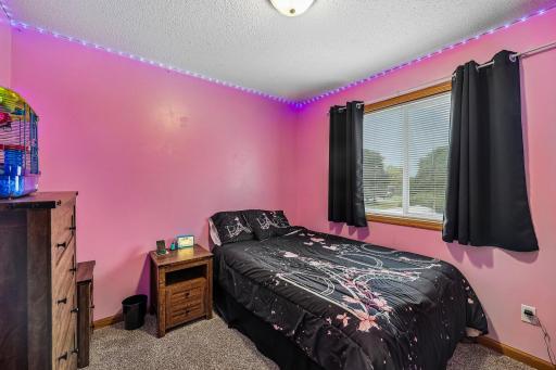 Spacious third bedroom with room to accommodate a variety of needs.