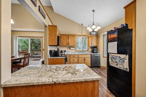 Updated kitchen featuring newer countertops and stainless-steel appliances.