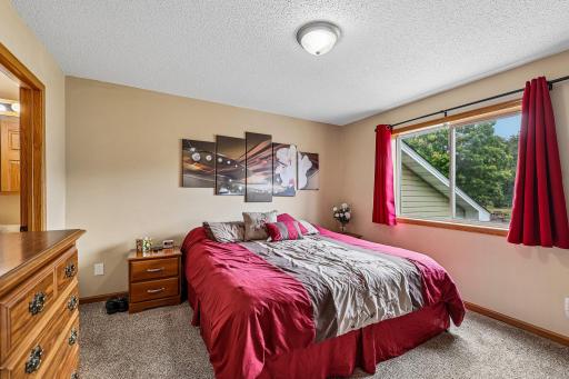 Bright primary bedroom offers a peaceful retreat.