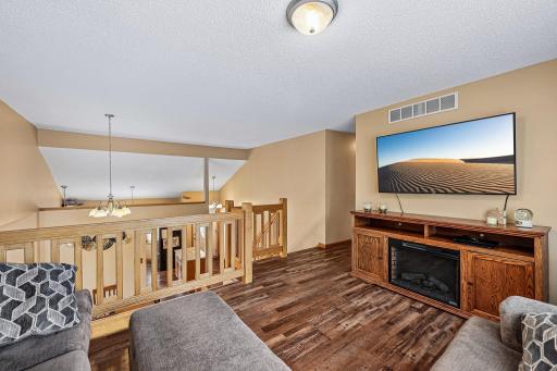 Open sightlines and natural light enhance the lofted living area.