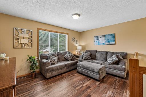 Bright lofted living area with an open, inviting feel.