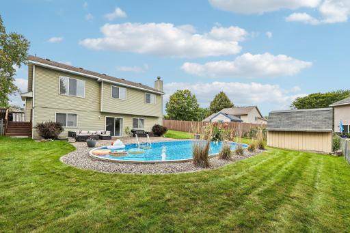 Spacious backyard offers plenty of room to relax, play, and entertain.
