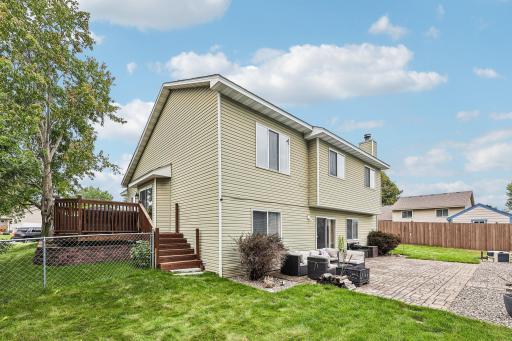 Well-maintained rear exterior with easy access to the backyard and deck.