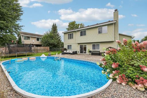 Private backyard retreat featuring an impressive 18x34 in-ground pool.