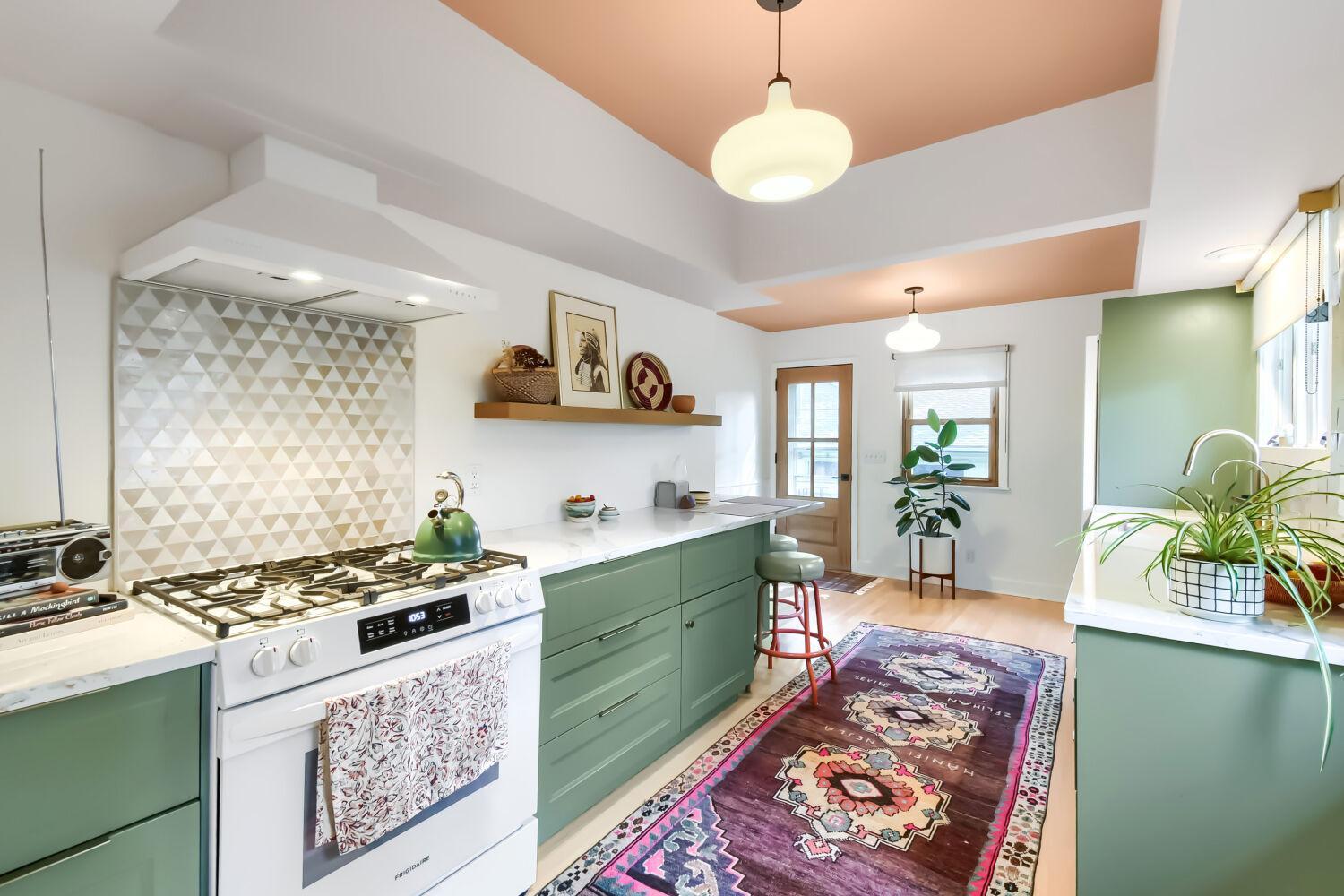 Kitchen with unique ceiling soffit and generous countertop area.