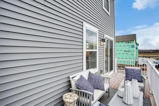 This GIANT deck allows room for everyone...to grill AND chill! *Model home, colors and selections will vary.