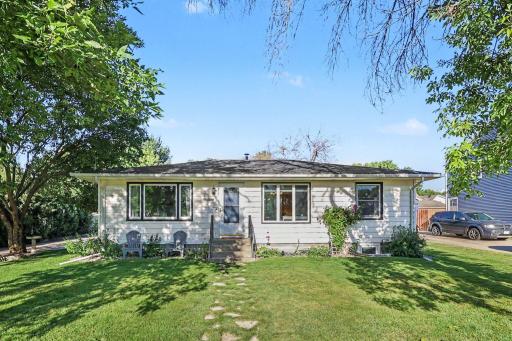 Front exterior view highlighting the homeâs mid-century rambler design.