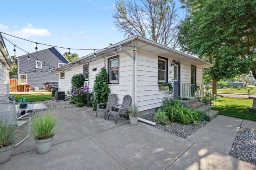 Patio and front entry area with outdoor seating and easy access to the home.