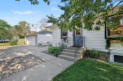 Front entry and detached 22x26 garage with concrete driveway.