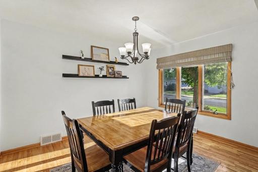 Main-level dining room with natural light and open flow to the living space.