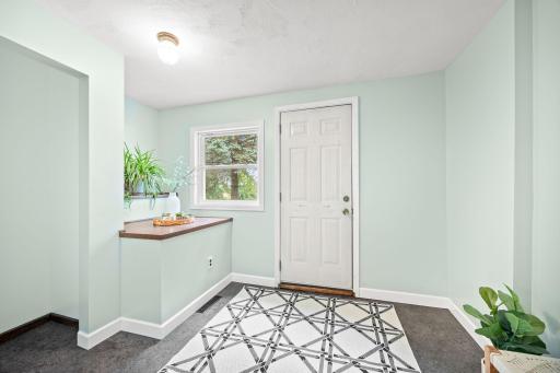 Spacious and fresh look front entryway.