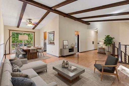 Beautifully open and freshly painted layout featuring gorgeous wood-beamed ceilings, bright open-concept living, and seamless flow to the deck! *Virtually staged to show design options.