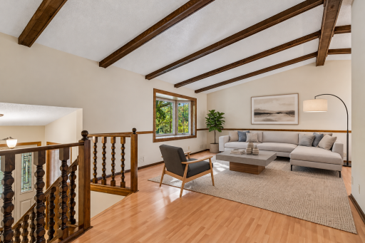 Another angle showing the sunlit upper level, highlighting the dramatic vaulted ceiling and open layout! *Virtually staged to show design options.