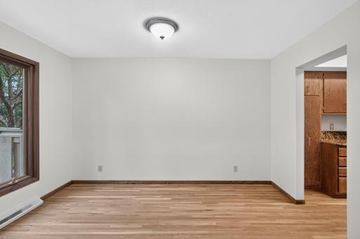 It is conveniently located next to the kitchen and looks out onto the front porch
