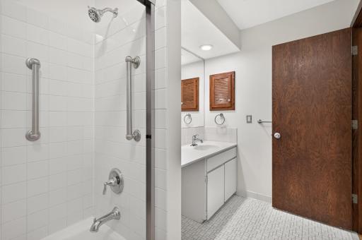 Ceramic tile... bathtub/shower even has safety grab bars