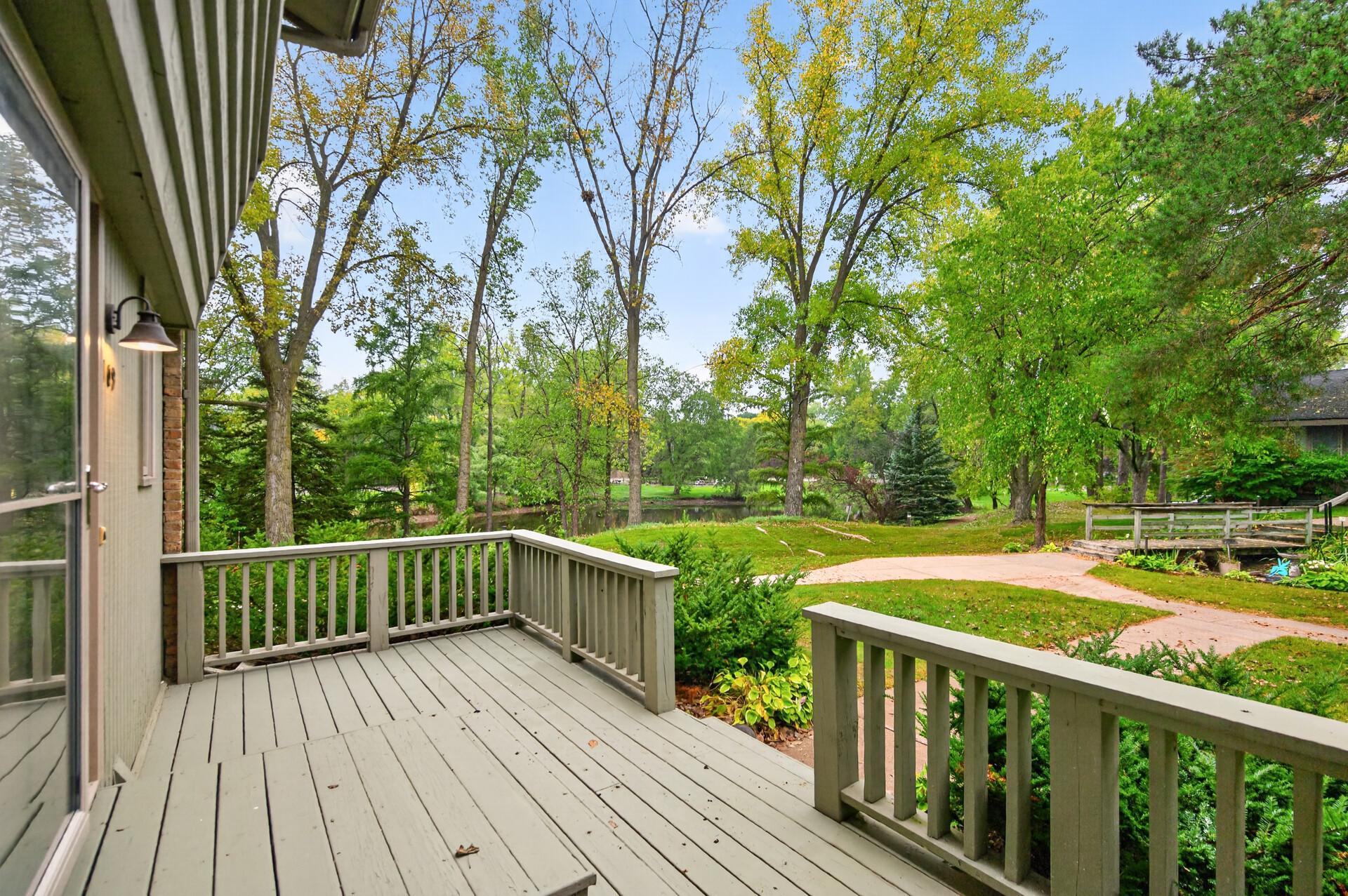 One of only a few units with a front porch in Windsor Green... and a peaceful pond view