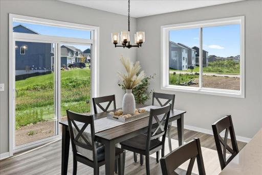 PHOTO OF A DIFFERENT HOME WITH SIMILAR PLAN AND FINISHES.