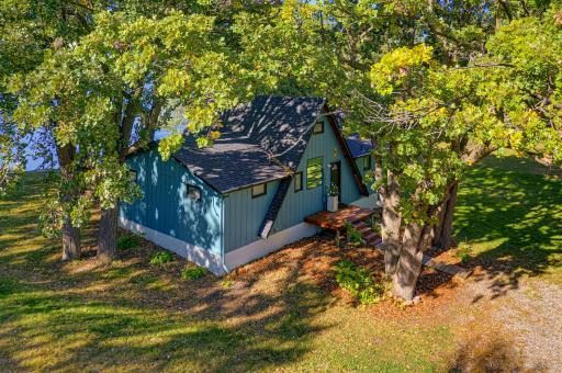 Situated on 1.52 acres, this property features a gentle slope towards Clear Lake.