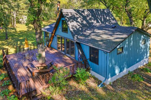 An expansive deck is situated on the back of the home facing Clear Lake.