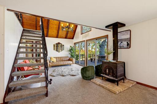 A view of the living room. The wood burning stove provides additional heat.