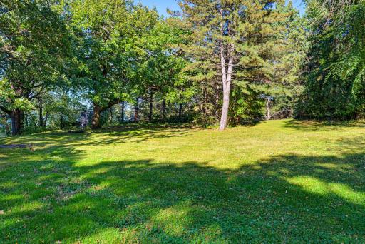 Situated on 1.52 acres, this property features a gentle slope towards Clear Lake.