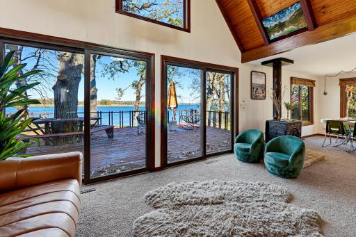 Sliding patio doors provide access to the expansive deck and views of Clear Lake.