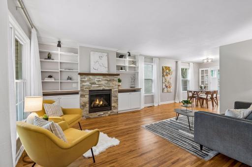 Photo for 3020 Kentucky Avenue S, Saint Louis Park, MN 55426 - listing #7133835 Beautiful living room with hardwood floors, built-ins, and gas fireplace with stone surround.