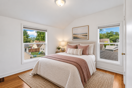 Second upper-level bedroom with hardwood floors. (Virtually staged)