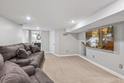 Finished lower-level family room offers additional living and hangout space.