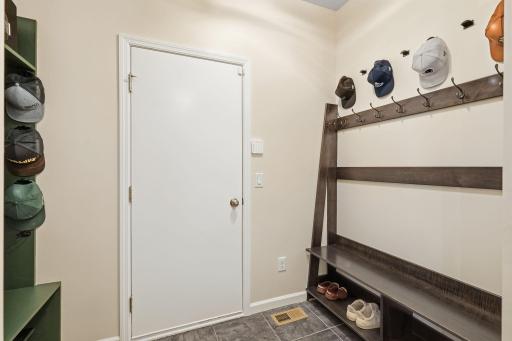 Mudroom right off the garage with built in cabinetry!