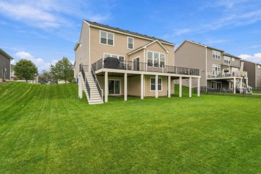 Massive maintenance free decking that extends the entire length of the back of the home.